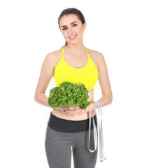 Canvas Print - Beautiful young woman with measuring tape and lettuce on white background. Diet concept