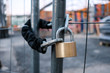 © hanohiki - chain and padlock on gate at construction site