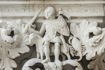 Wall Mural - Planet Mars as Medieval knight between Aries and Scorpio zodiac signs ancient relief, on Venice Doge Palace capital 