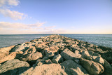 Fototapeta Desenie - Barcelona beach stone pier in the Barceloneta