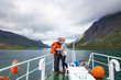 © lkoimages - Sport couple hiking on Besseggen. Hikers enjoy beautiful lake and good weather in Norway.