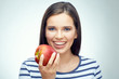 © Yuriy Shevtsov - Smiling girl with dental braces holding red apple.