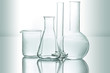 canvas print picture - set of chemical glassware on reflective surface