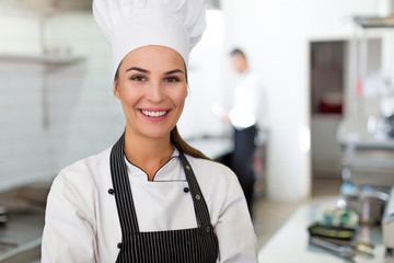 Female chef in kitchen
