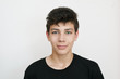 © Мар'ян Філь - A teenager in a black T-shirt stands. On a white background