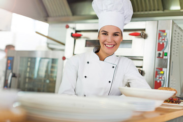 Female chef in kitchen
