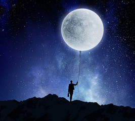 woman catching moon . mixed media