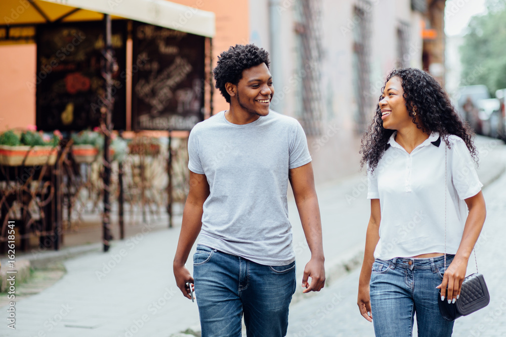 Young African American Couple Walking In The City Center Stock Photo ...