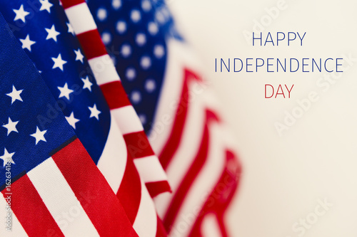 Poster text happy independence day and american flags