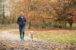 © Monkey Business - Mature Woman On Autumn Walk With Labrador