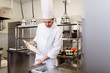 © Syda Productions - chef with clipboard doing inventory at kitchen