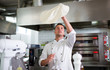 © pikselstock - Chef tossing pizza dough
