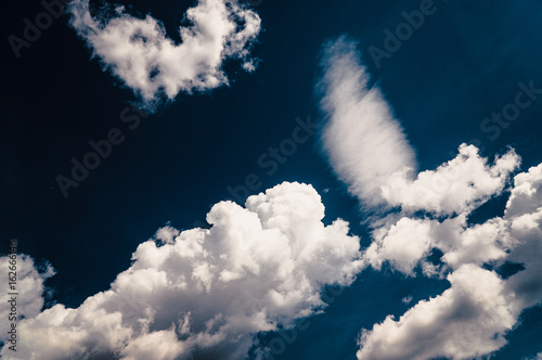 White Clouds On The Background Of A Gloomy Dark Blue Sky On A Summer Day Background Backdrop Or Beautiful Wallpaper Buy This Stock Photo And Explore Similar Images At Adobe Stock