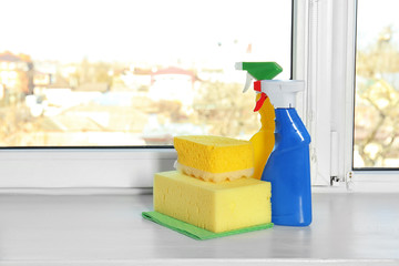 Cleaning supplies on window sill