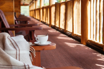 Poster - cup of coffee and plaid on terrace