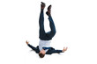 © LIGHTFIELD STUDIOS - young businessman in suit falling upside down isolated on white