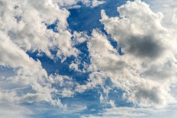 white clouds in the blue sky.