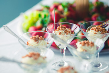 Decorated catering banquet table with different food appetizers assortment on a party
