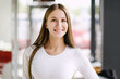 © spaskov - Woman smiling with perfect smile and white teeth in a mall looking at camera