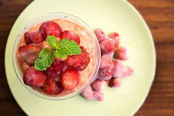 Wall Mural - Strawberry smoothies in plastic cup. Refreshment healthy drink.