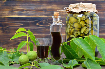 Preparing unripe walnut liqueur. Nocino liqueur