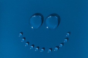 Happy face made of water drops