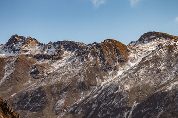 Close up shot of brown mountain with snow and cloud on the top at Thangu and Chopta valley in winter in Lachen. North Sikkim, India.