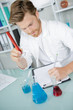 © auremar - research worker doing experiments with chemical liquid at laboratory