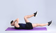 © Africa Studio - Young man doing bicycle crunch exercise on white background