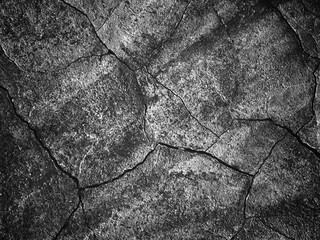 Wall Mural - black wall with faults, texture for the background