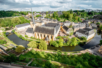 Canvas Print - Top view on the Grund district with saint Johns church and Neumunster abbey in Luxembourg city