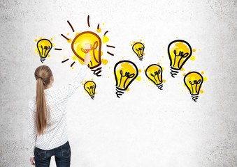 Poster - blond woman drawing light bulbs