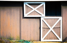 Weathered  Brown And White Barn With Dutch Door