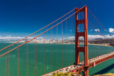 Fototapeta Mosty linowy / wiszący - Day time shot of Golden Gate Bridge in San Francisco, California