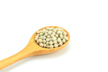 Wall Mural - Peppercorn with wooden spoon on white background. Composition isolated over the white background.