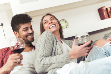 Wall Mural - couple sitting on sofa and watching movie