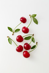 Wall Mural - Sour cherries on white background. Organic sour cherry, ripe.