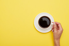 Flat Lay Of Cup Of Delicious Coffee In Woman Hand