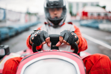 Wall Mural - Karting race, go cart driver in helmet