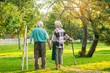© DenisProduction.com - Old couple holding hands outdoor. Gardeners standing on grass.