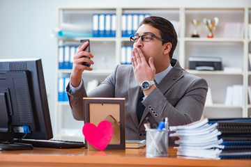 Businessman in saint valentine concept in office