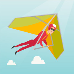 Canvas Print - Young caucasian man flying on hang-glider.