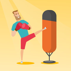 Poster - Young caucasian man exercising with punching bag.