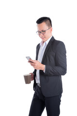 Wall Mural - Young asian businessman reading message on cellphone over white background