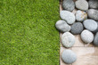 Artificial grass on balcony floor with pebbles