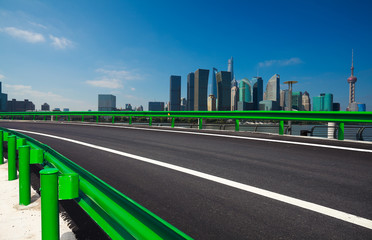 Empty road surface floor with city landmark buildings