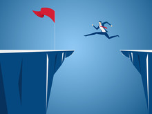 Businessman Jump Through The Gap Obstacles Between Hill To Red Flag And Success. Running And Jump Over Cliffs. Business Risk And Success Concept.