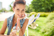 Lovely young smiling woman drinking lemonade. Summer concept