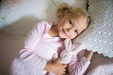 Wall Mural - Girl relaxing on bed in the bedroom