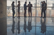 © alfa27 - Silhouettes of business people in a conference room.
